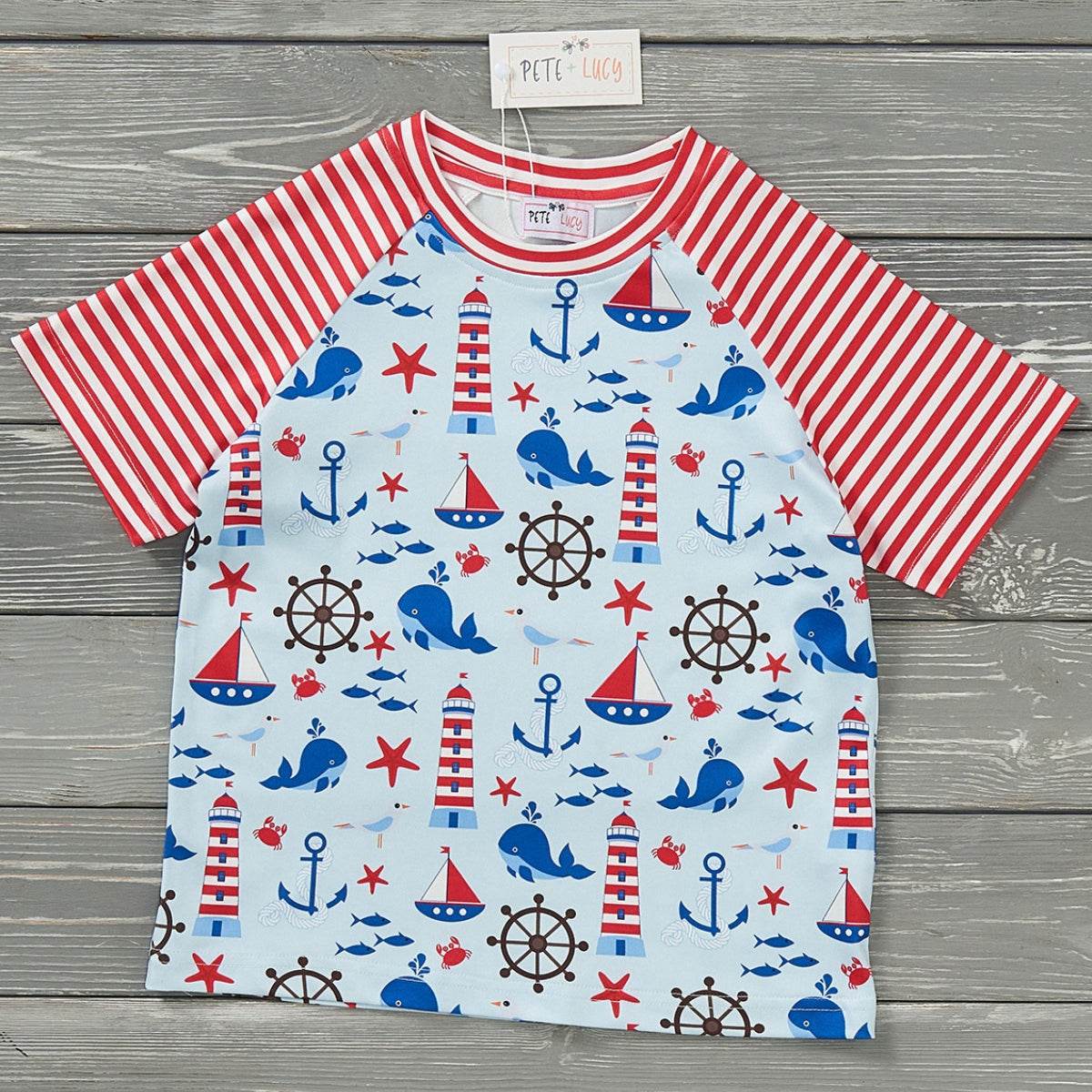 Raglan boy top with nautical print, red striped sleeves, anchors and lighthouses.