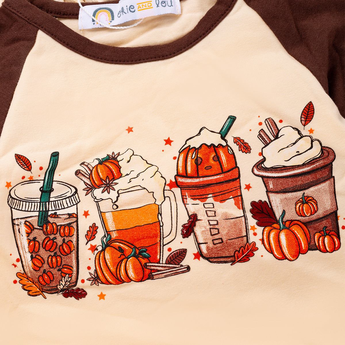 Cozy Cup Fall Romper with autumn drinks graphic featuring pumpkin spice lattes, hot chocolate, and apple cider on cream and brown fabric.