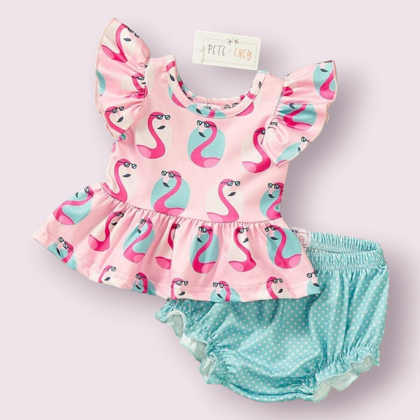 Cool Flamingo 2 Piece Set with pink flamingo print top and blue polka dot shorts.