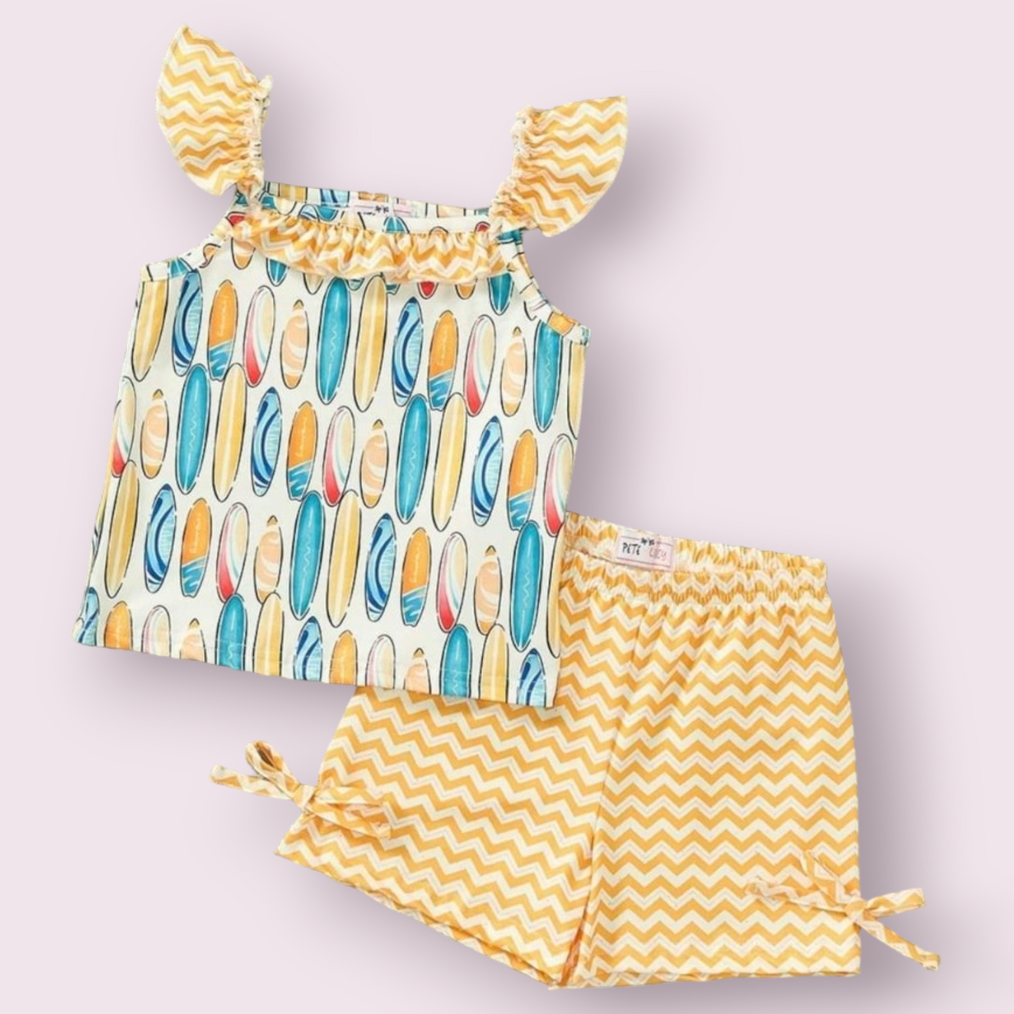 Colorful surfboard-themed 2 piece set with chevron shorts, made from P-Lush fabric.