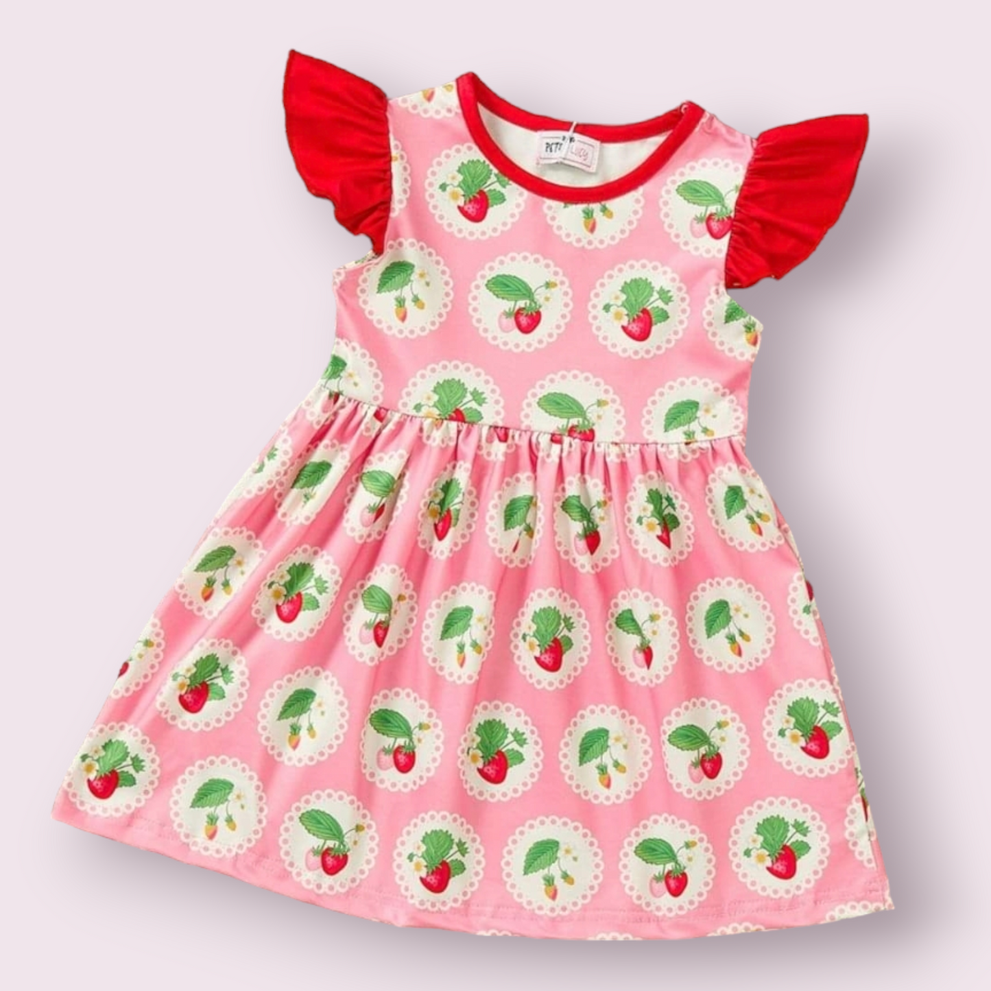 Summer Strawberry Dress with strawberry print and red sleeves.
