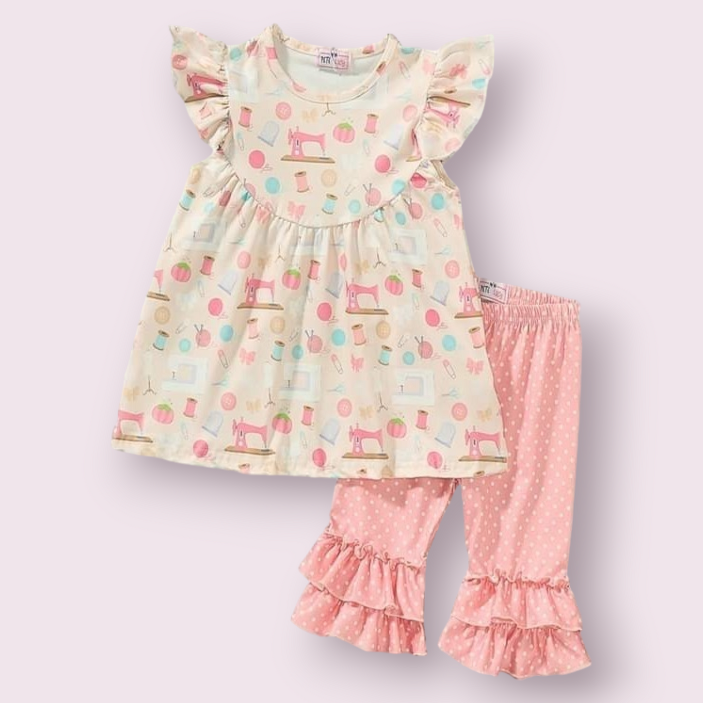 Sewing Kit Capri Set with colorful print, featuring short-sleeved tunic and ruffled capri pants.