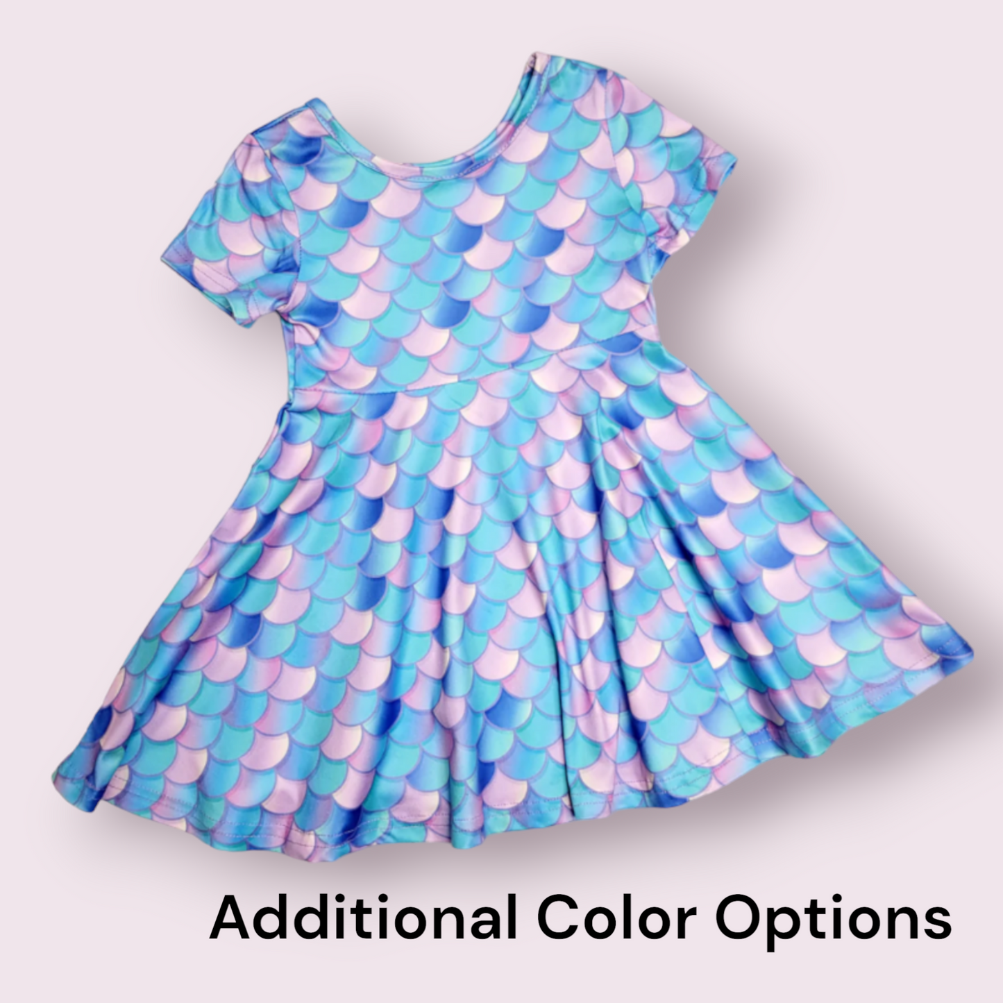 Mermaid dress with colorful scale pattern and short sleeves.