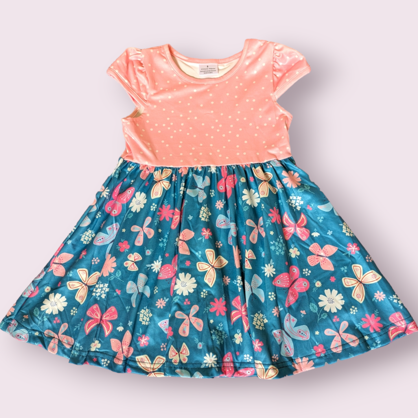 Butterfly Floral Dress with pink polka dot top and colorful butterfly print skirt.