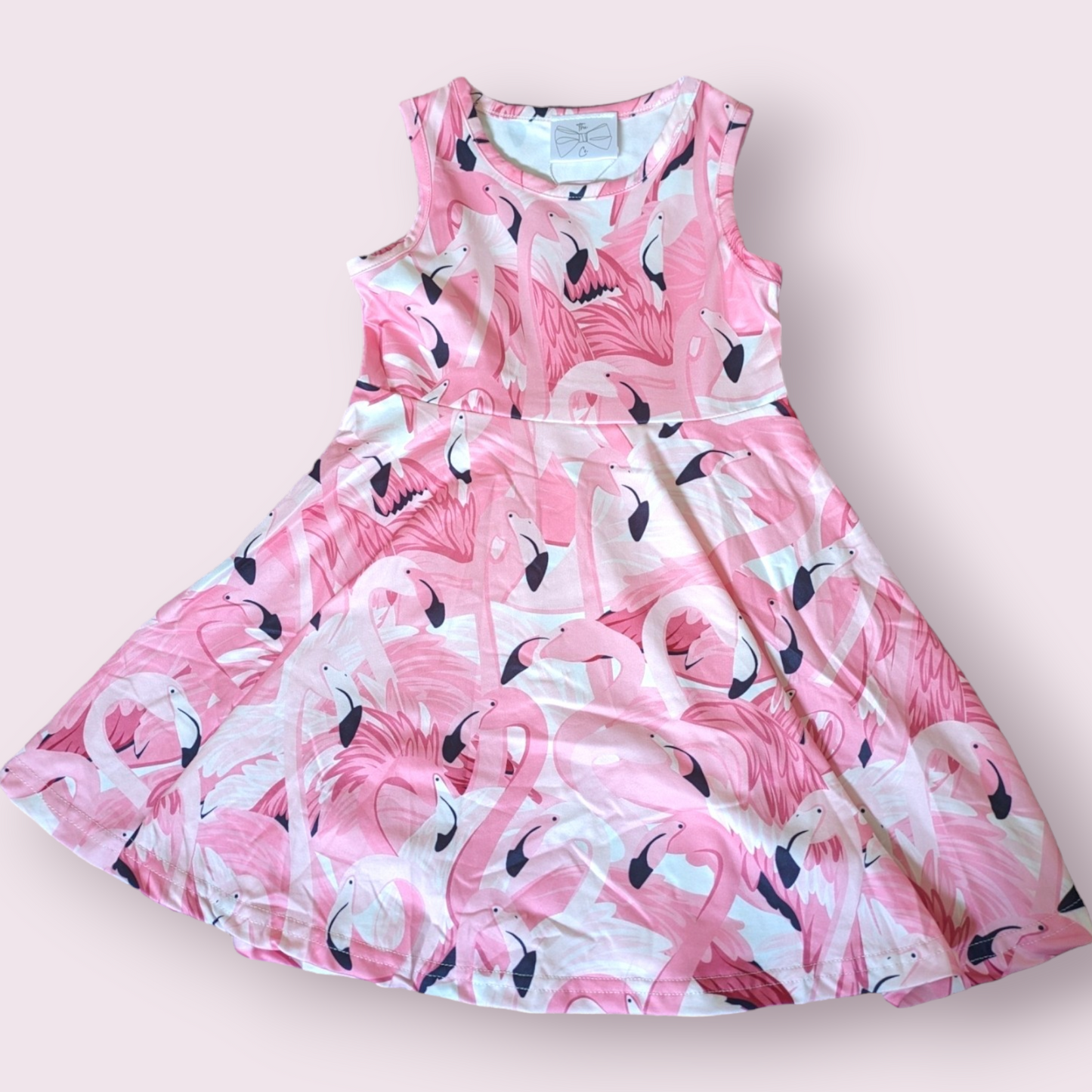 Flamingo Frenzy Dress in pink with flamingo print, 95% polyester, 5% spandex.