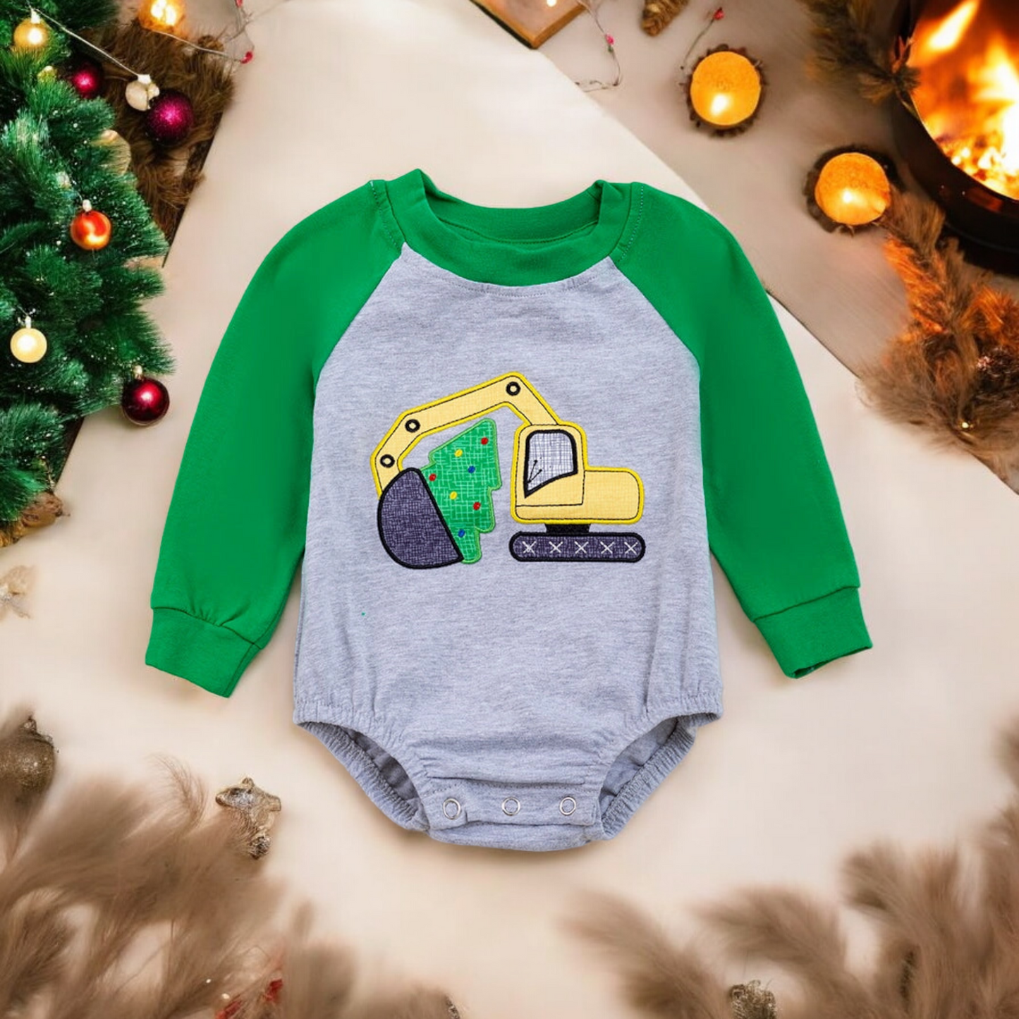 Baby onesie with green sleeves and gray body featuring a colorful excavator and Christmas tree appliqué, perfect for festive construction-themed wear.