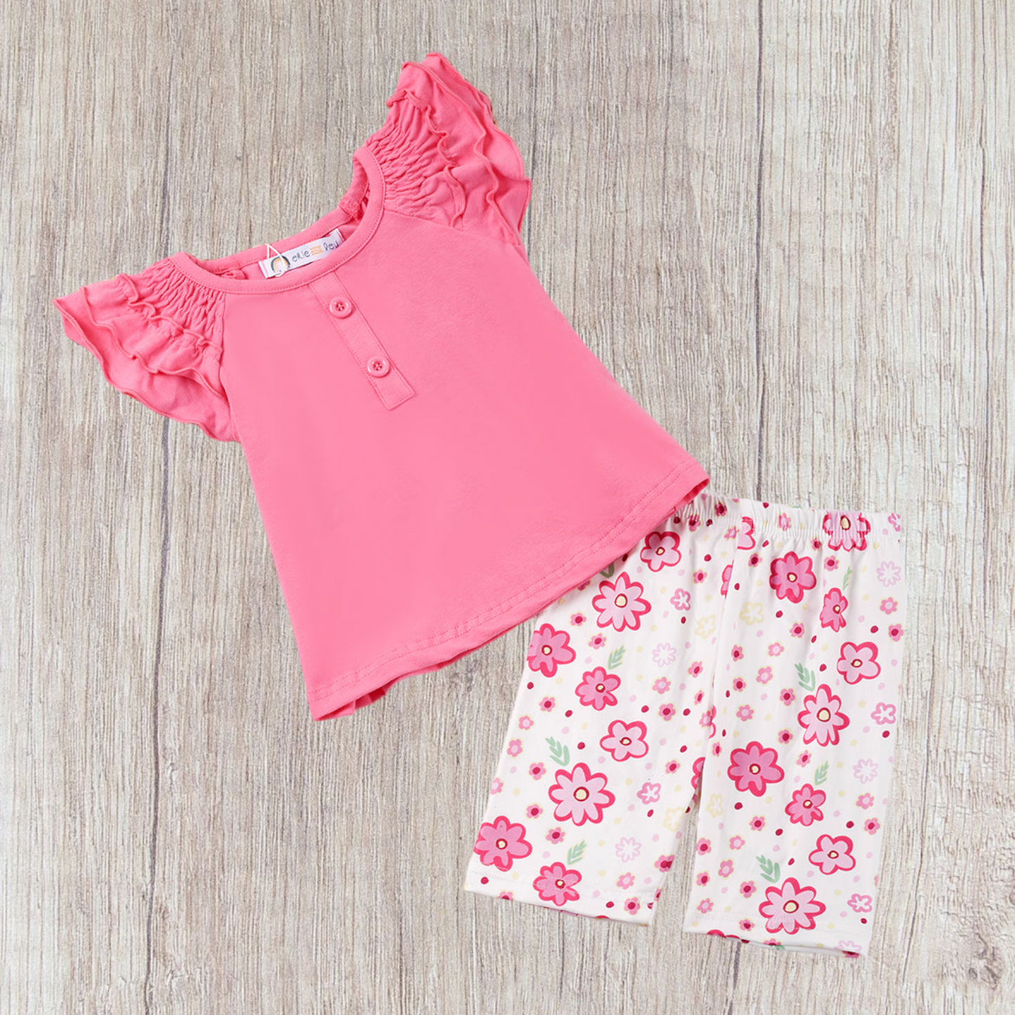 Plum Passion 2 Piece Set featuring a vibrant pink top and floral patterned leggings for girls.
