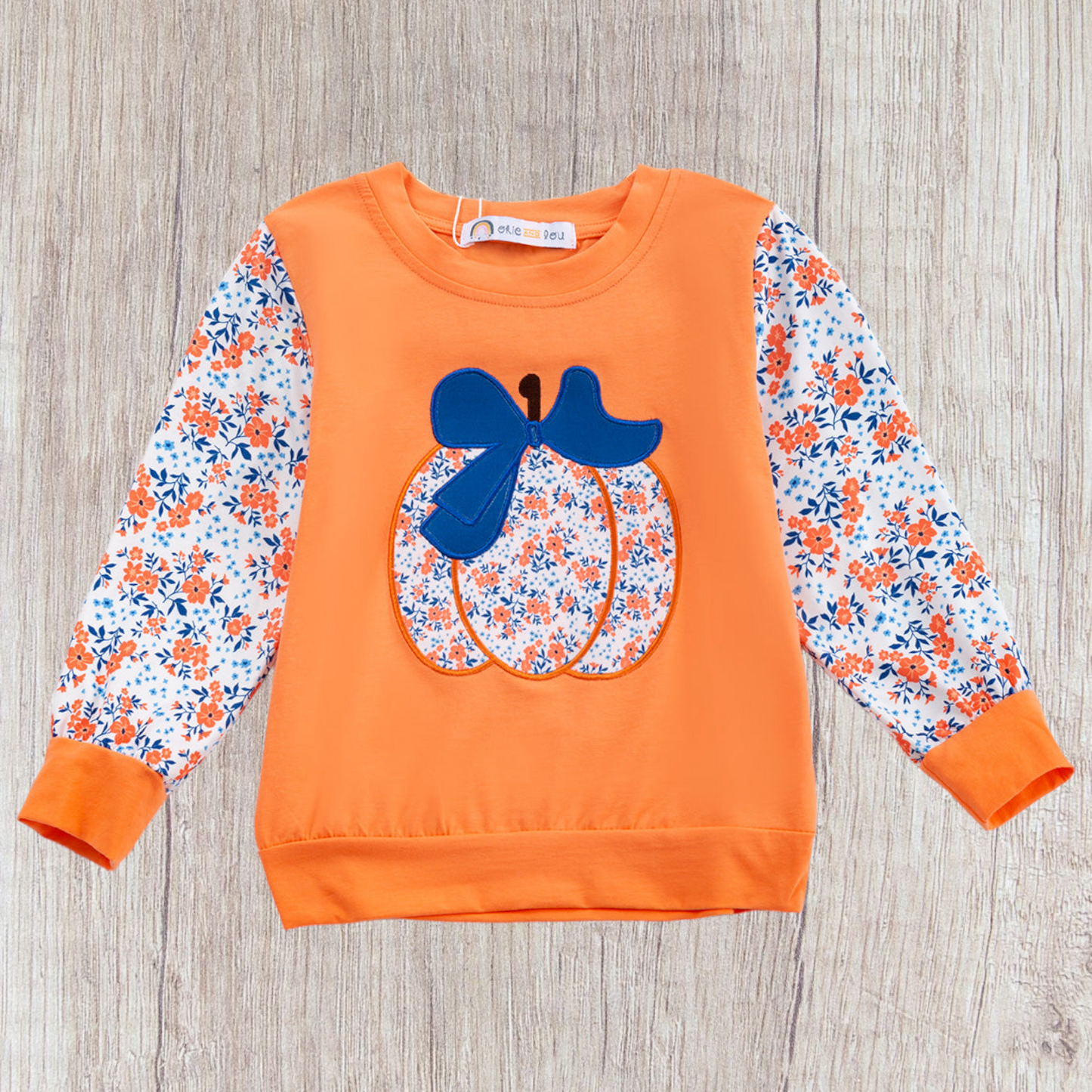 Orange toddler sweatshirt with floral pumpkin design and floral print sleeves, Garden Gourds Top for fall.