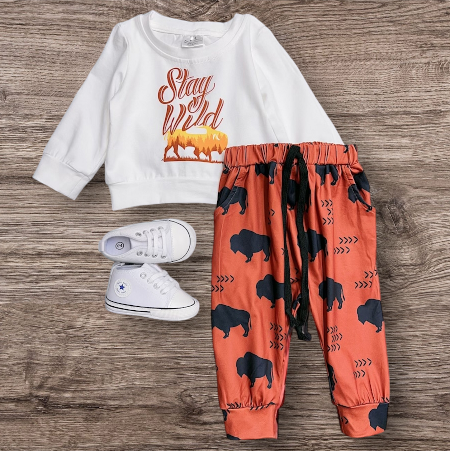 Boy's "Stay Wild" 2-piece set with long-sleeved shirt and printed joggers, shoes not included.