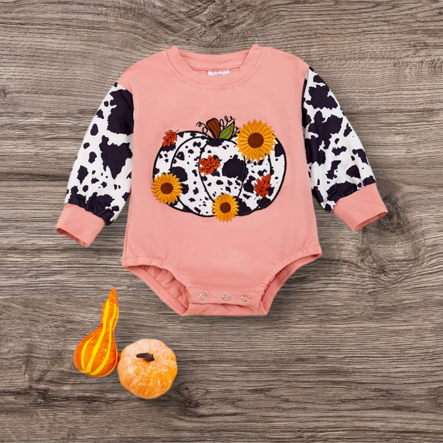 Sunflower Pumpkin long sleeve onesie with snap closure and embroidered design.