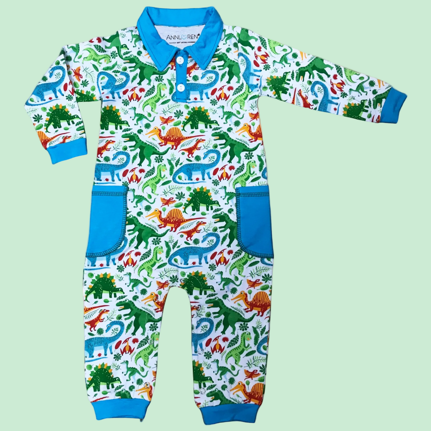 Dinosaur print boy's long sleeve romper with blue collar and cuffs.