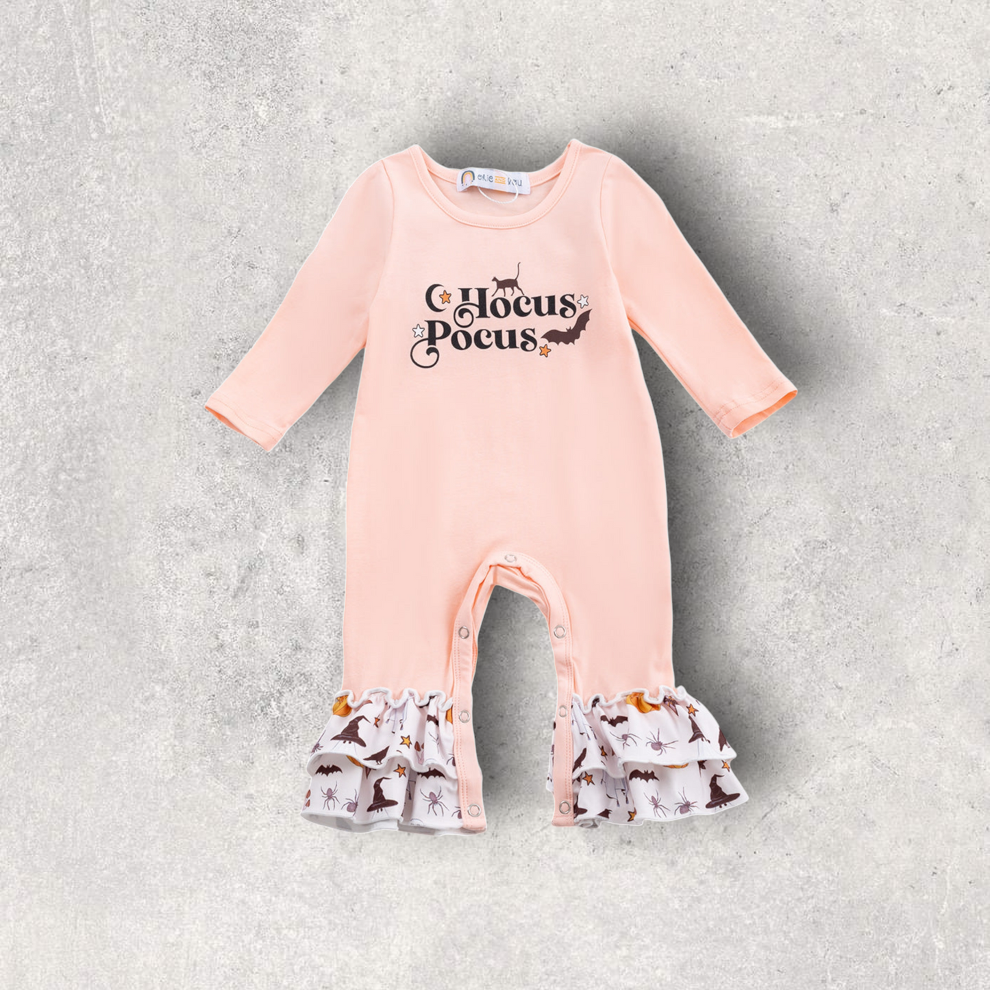 Peach Hocus Pocus romper with Halloween-themed ruffle legs and front graphic