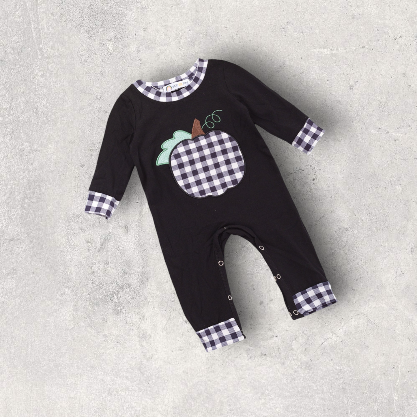 Pumpkin plaid boy romper with gingham pumpkin appliqué and plaid cuffs on black fabric for fall
