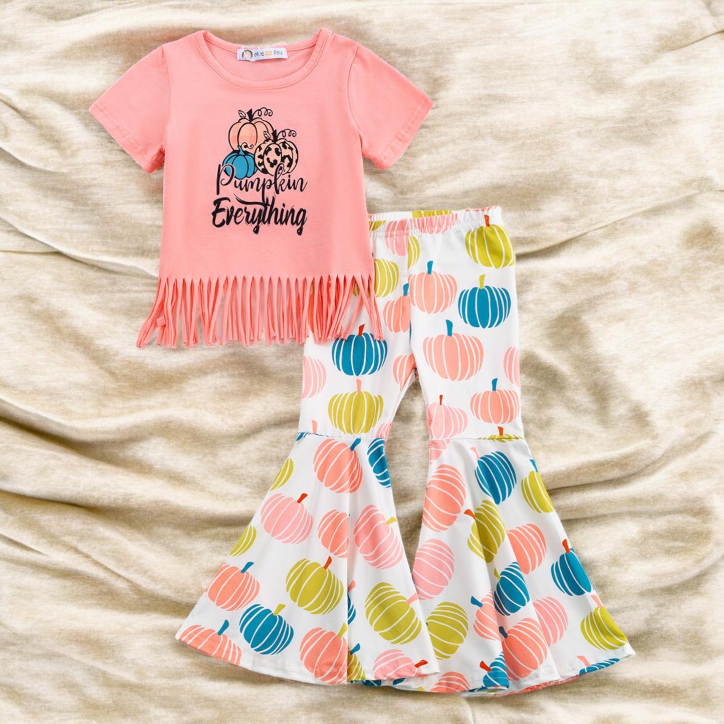 Toddler Pumpkin Everything Outfit with coral fringe top and multicolored pumpkin bell bottom pants