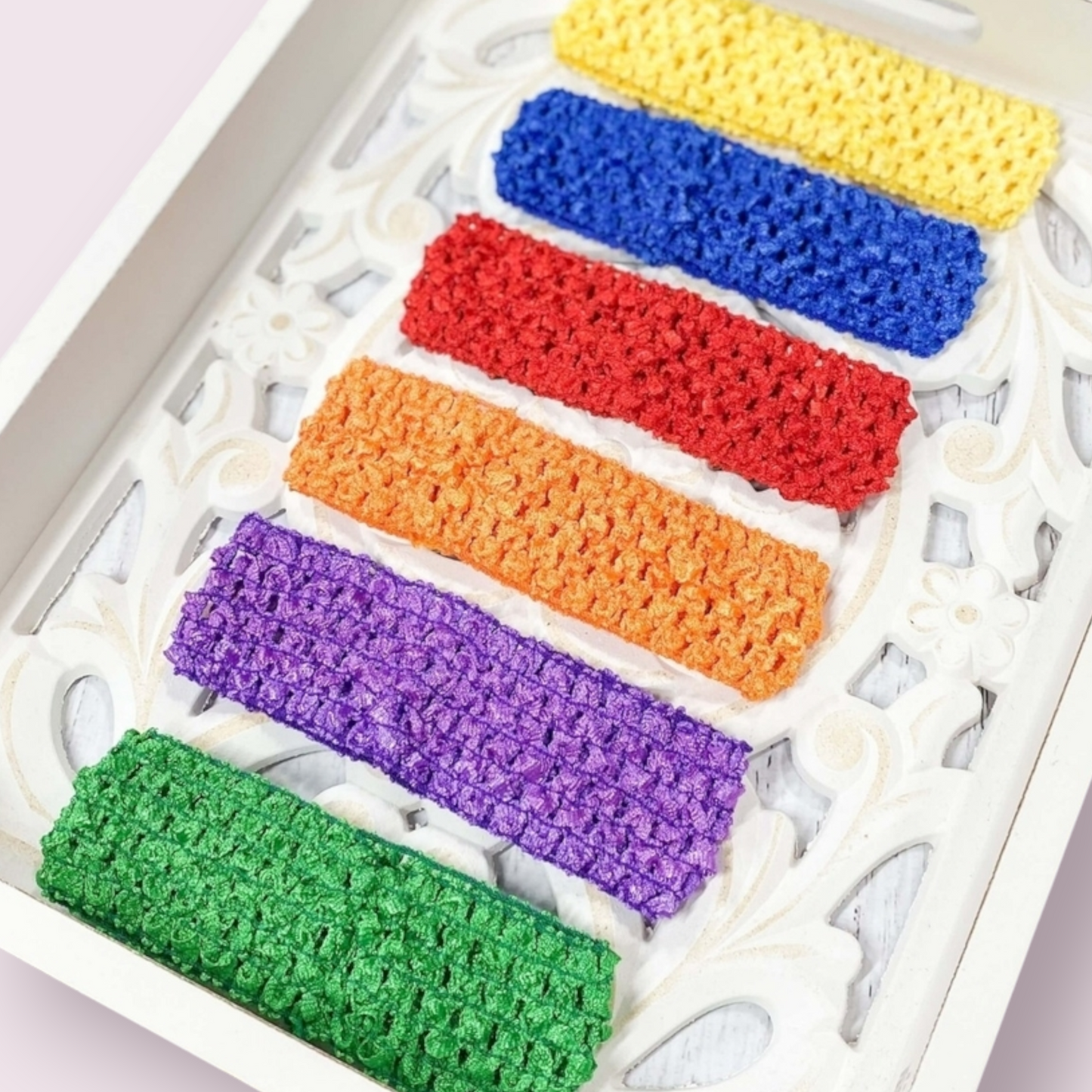 Ziva 1.5" headband pack in bold colors with six vibrant polyester bands: red, orange, yellow, green, blue, purple.