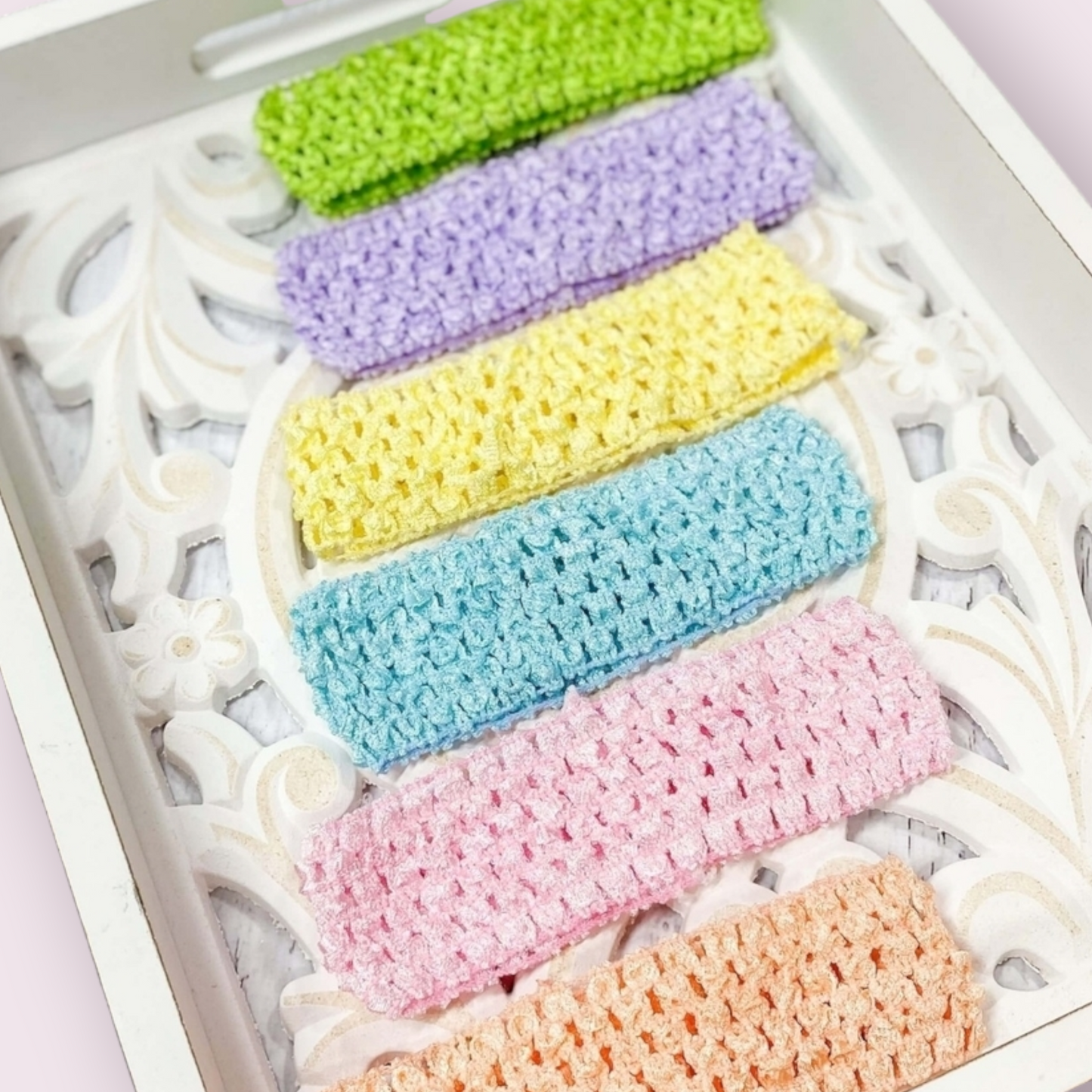 Pastel colored headband pack of six in light pink, peach, light yellow, lime green, blue aqua, and lavender.
