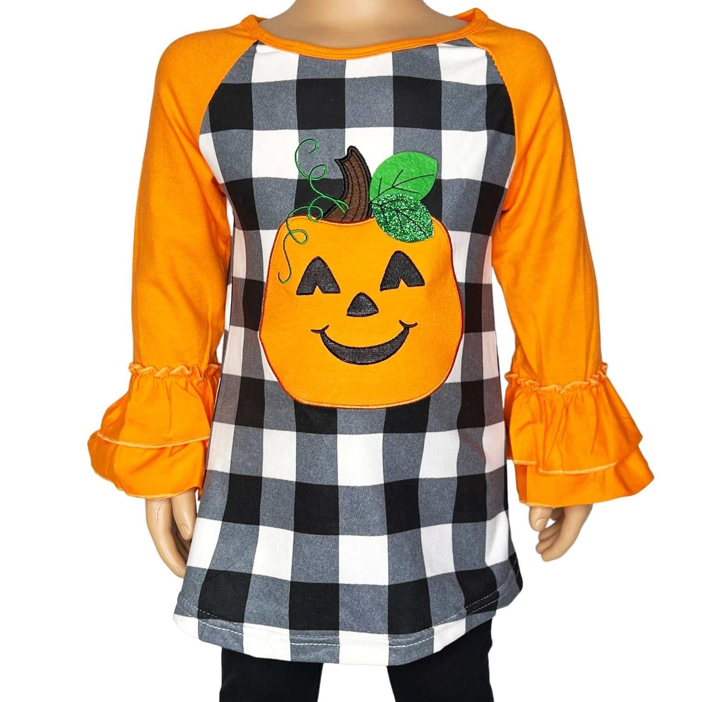 Fall Pumpkin Ruffle Shirt with Jack o Lantern applique and ruffled long sleeves.