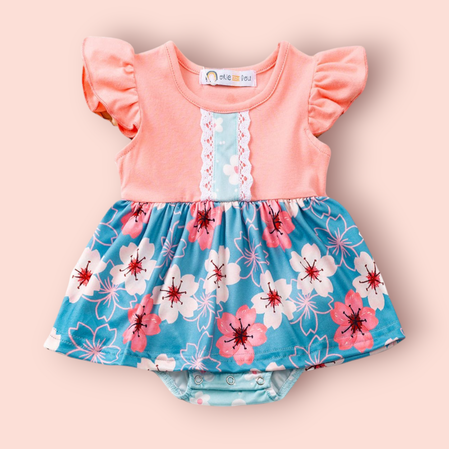 Ana Romper for babies with tropical floral design, perfect for summer outings.