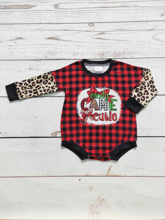 Baby romper, Candy Cane Cutie, in red and black buffalo plaid with leopard-print sleeves, black trim and festive graphic.
