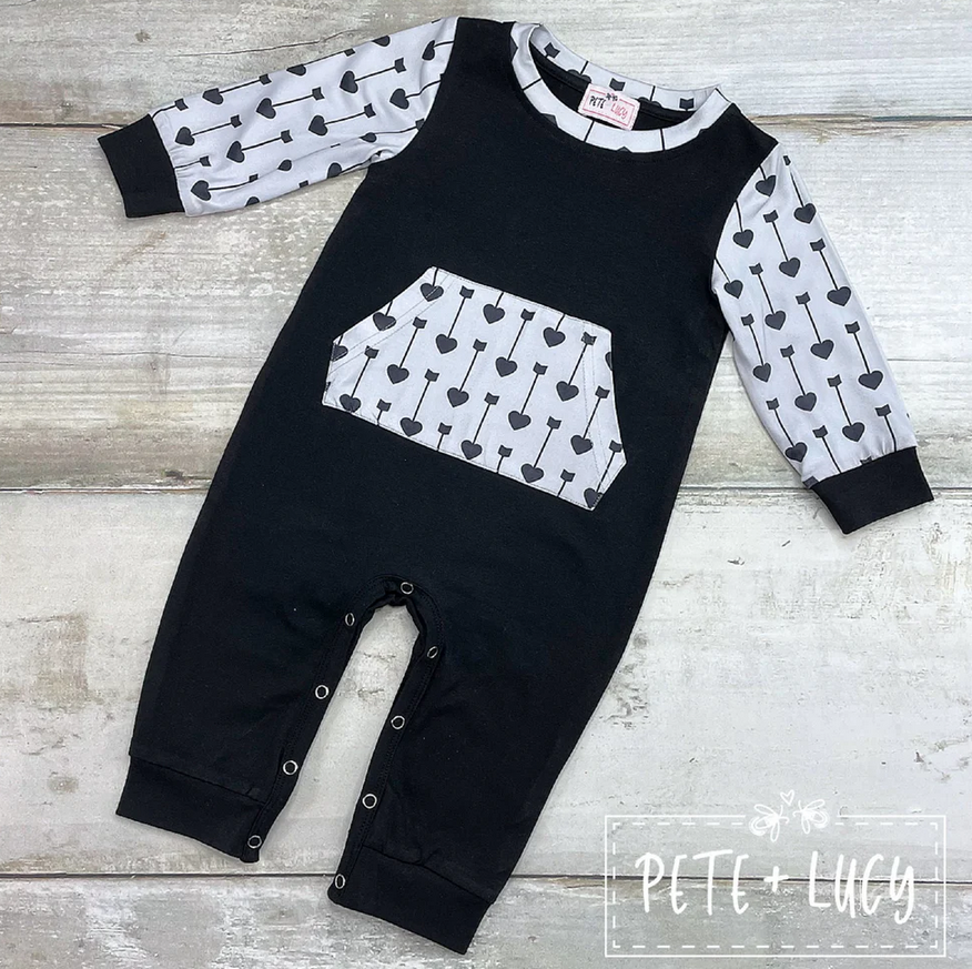 Wild Boy Romper with heart-patterned sleeves and pocket.