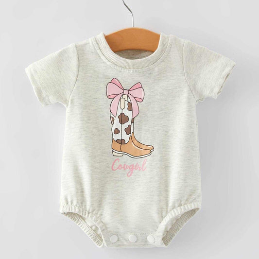 Cowgirl bodysuit with charming boots print, soft fabric, perfect for playtime.