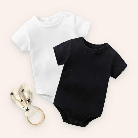 Baby bodysuit set with white and black bodysuits and rabbit ear teether.