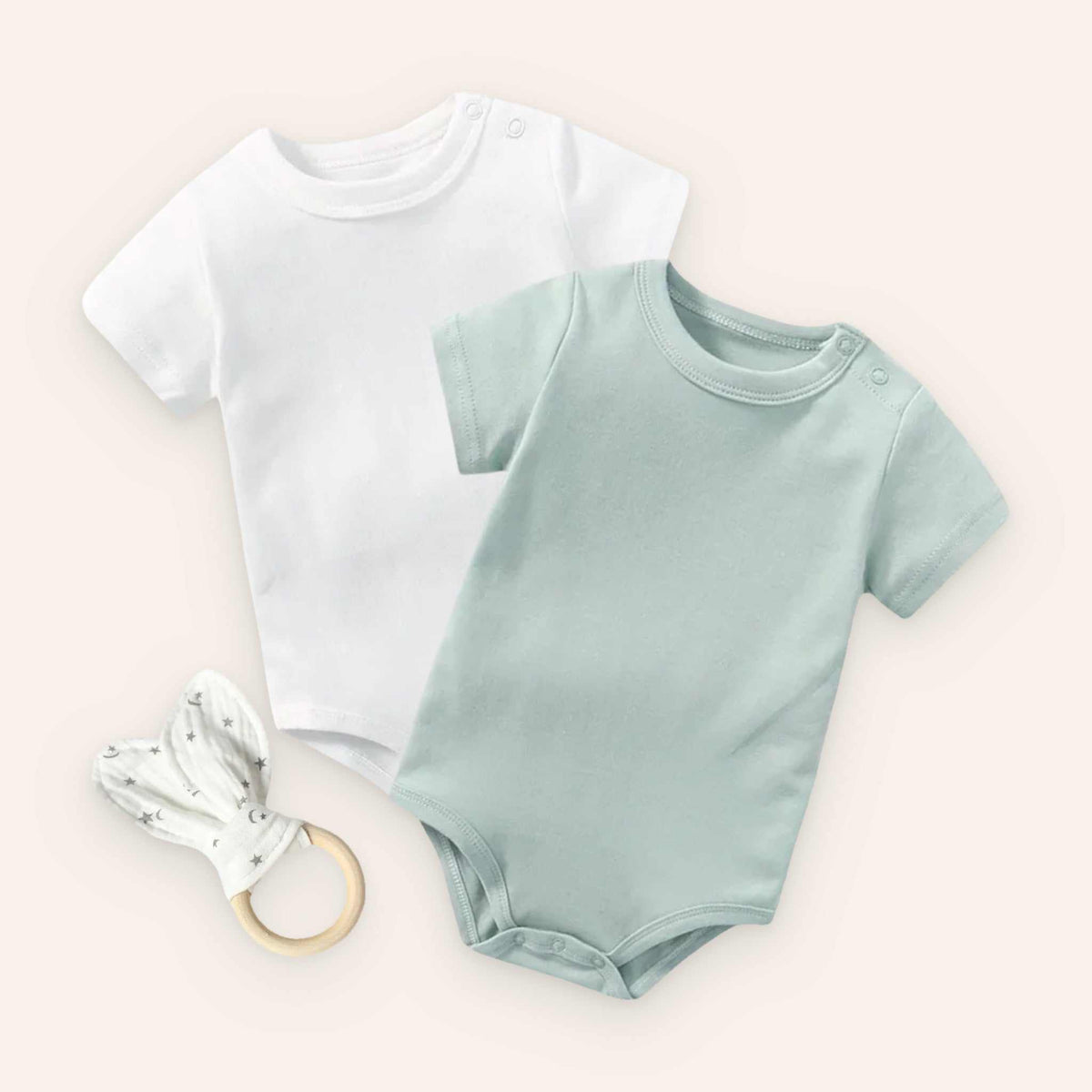 Baby bodysuit set in green and white with rabbit ear teether, soft cotton fabric.