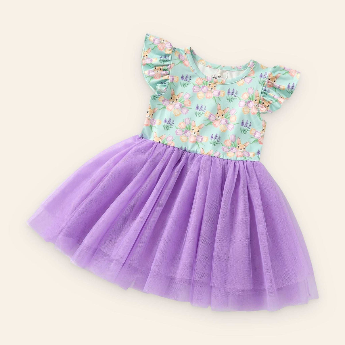 Child wearing Bunny Bouquet Tulle Dress with floral and bunny design, perfect for Easter and spring photos.