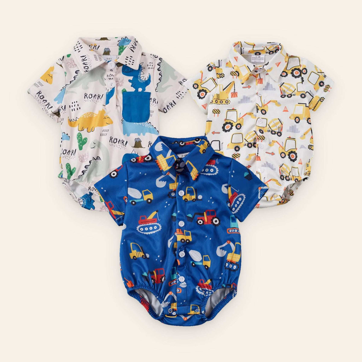 Baby boy collared onesie collection with dinosaur and construction vehicle prints, featuring snap closures for easy changes.