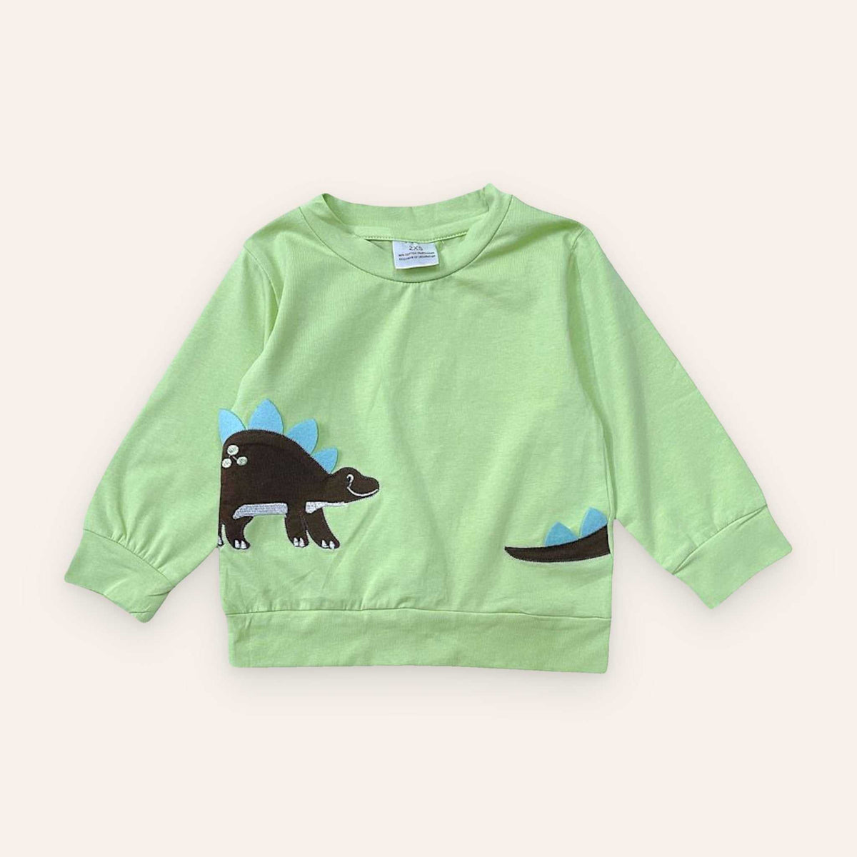 Green dinosaur sweatshirt for kids with blue and brown stegosaurus design, made of 95% cotton and 5% spandex.