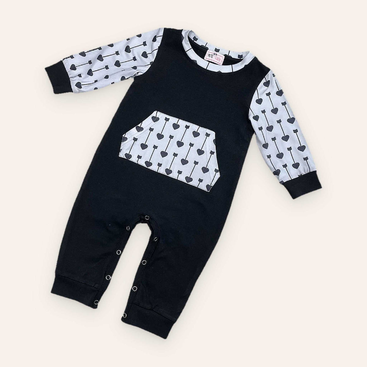 Wild Boy Romper with heart-patterned sleeves and pocket.