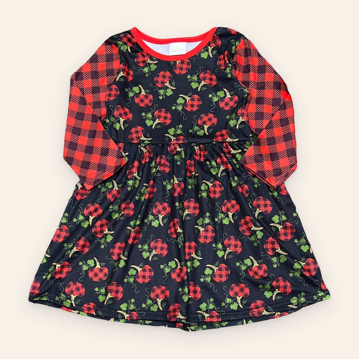 Kids plaid pumpkin dress with black base and red plaid sleeves for fall winter
