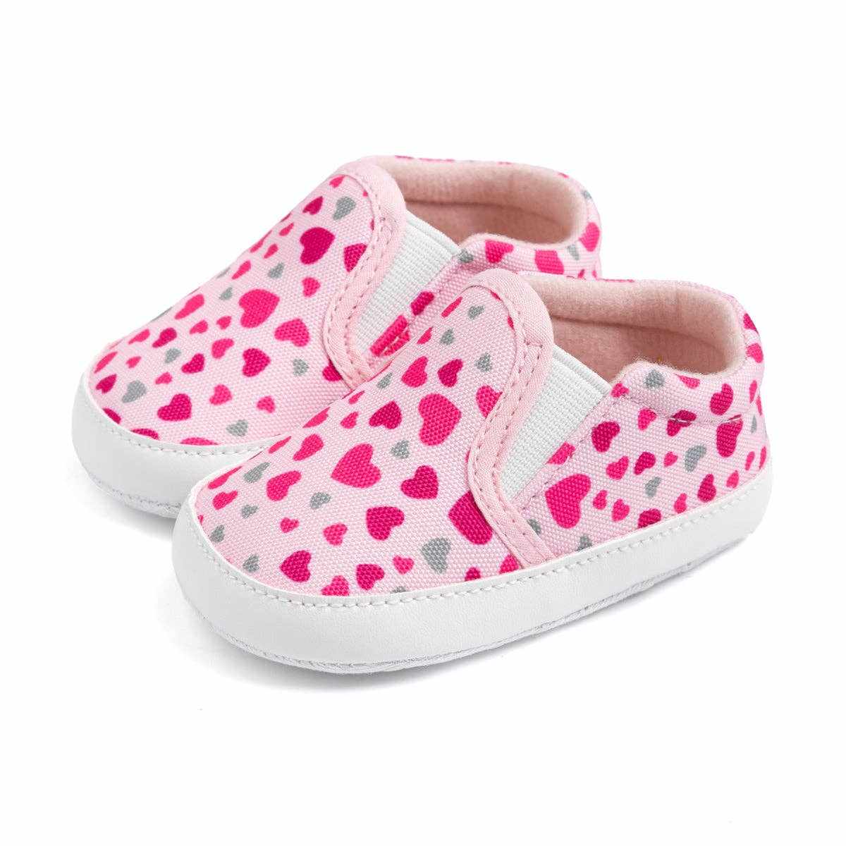 Pink heart slip on baby shoes with white soles and breathable fabric perfect for first steps