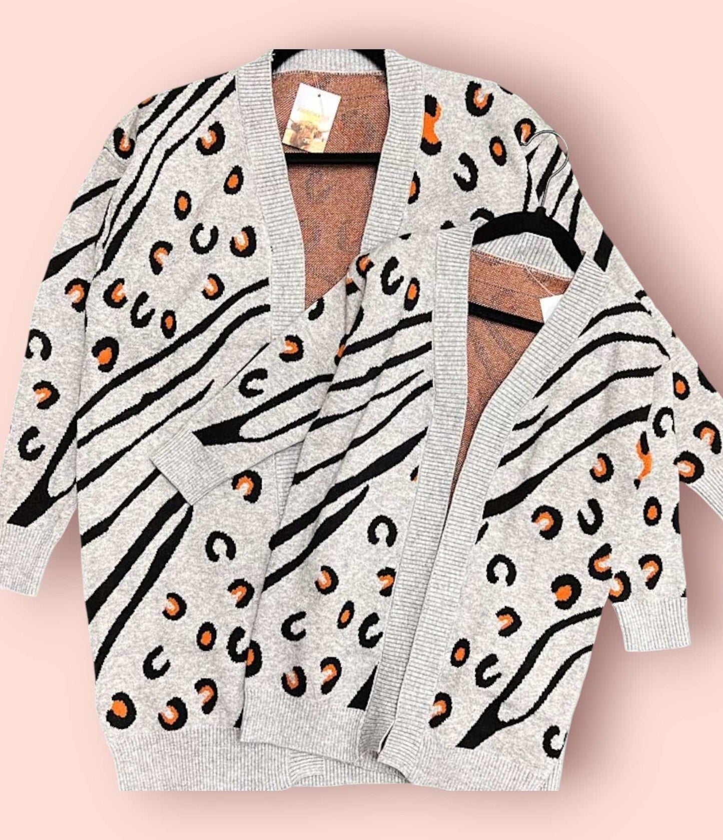 Matching mommy and child spotted cardigans with playful leopard print design and soft knit fabric