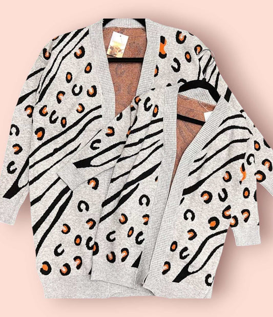 Matching mommy and child spotted cardigans with playful leopard print design and soft knit fabric