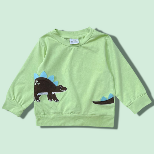 Green dinosaur sweatshirt for kids with blue and brown stegosaurus design, made of 95% cotton and 5% spandex.
