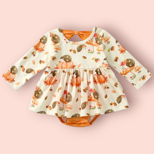 Baby romper with long sleeves featuring hedgehog and pumpkin prints, made of polyester and spandex blend, called Hedgehog Hollow Romper