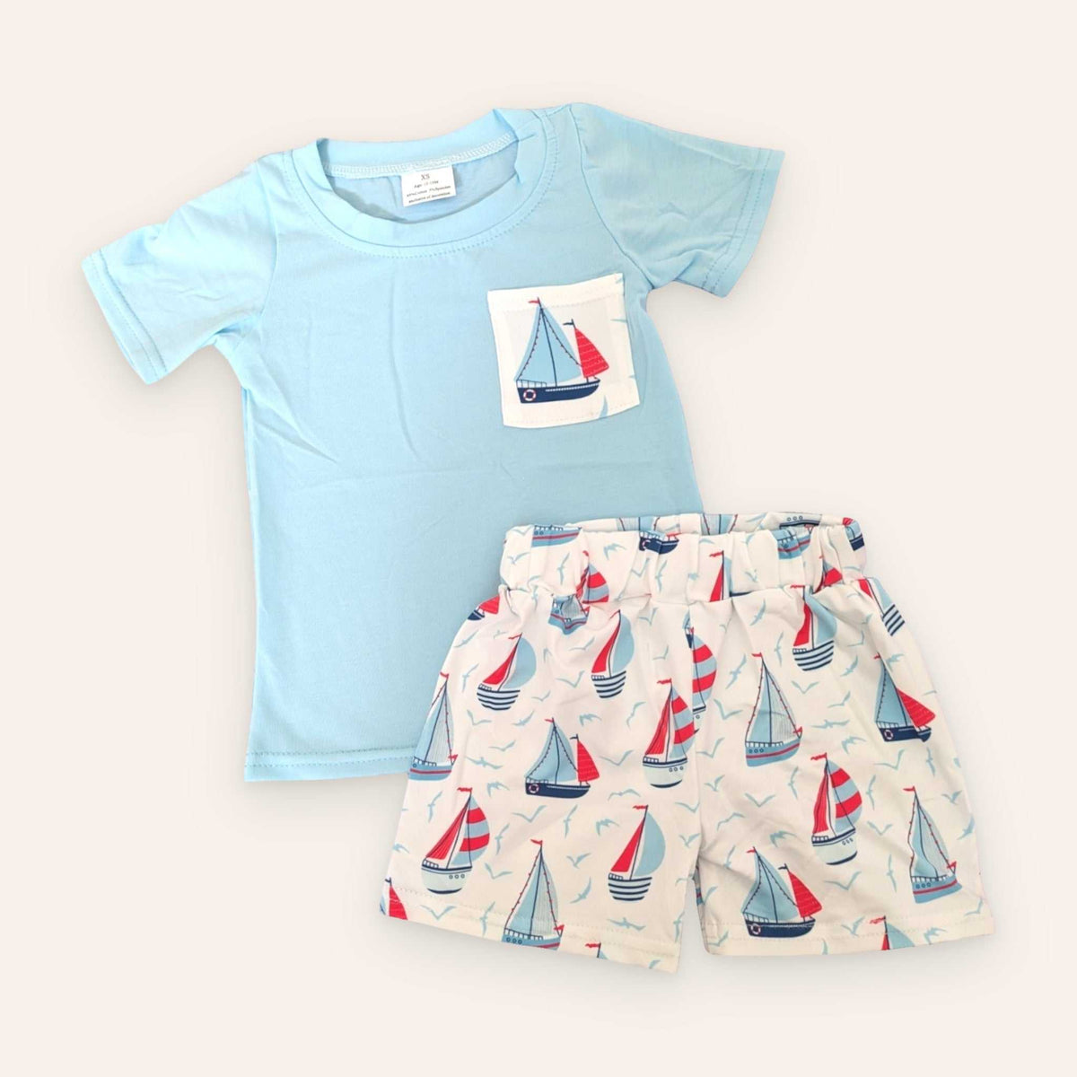 Light blue Sail Away Shorts Set with sailboat print; 95% cotton, 5% spandex; true to size fit.