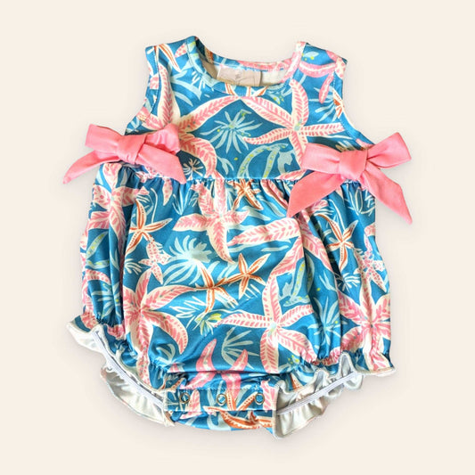 Starfish Galore Infant Romper with pink bows, starfish pattern, and sleeveless design.