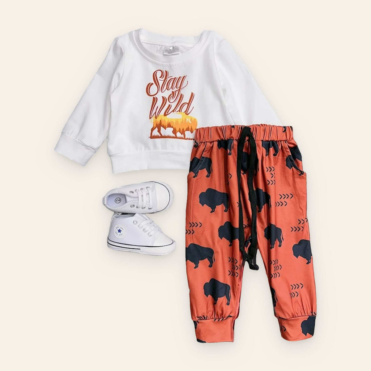Boy's "Stay Wild" 2-piece set with long-sleeved shirt and printed joggers, shoes not included.