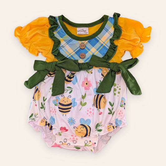 Cheerful Sunny Bee Romper with yellow ruffled sleeves, plaid bib, daisy accent, and bee print.