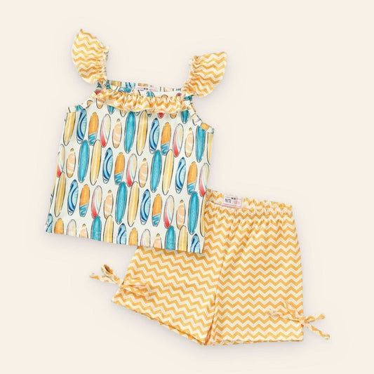 Colorful surfboard-themed 2 piece set with chevron shorts, made from P-Lush fabric.